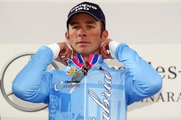 Daniele Pietropolli (Lampre-ISD) pulls on the winner's blue jersey