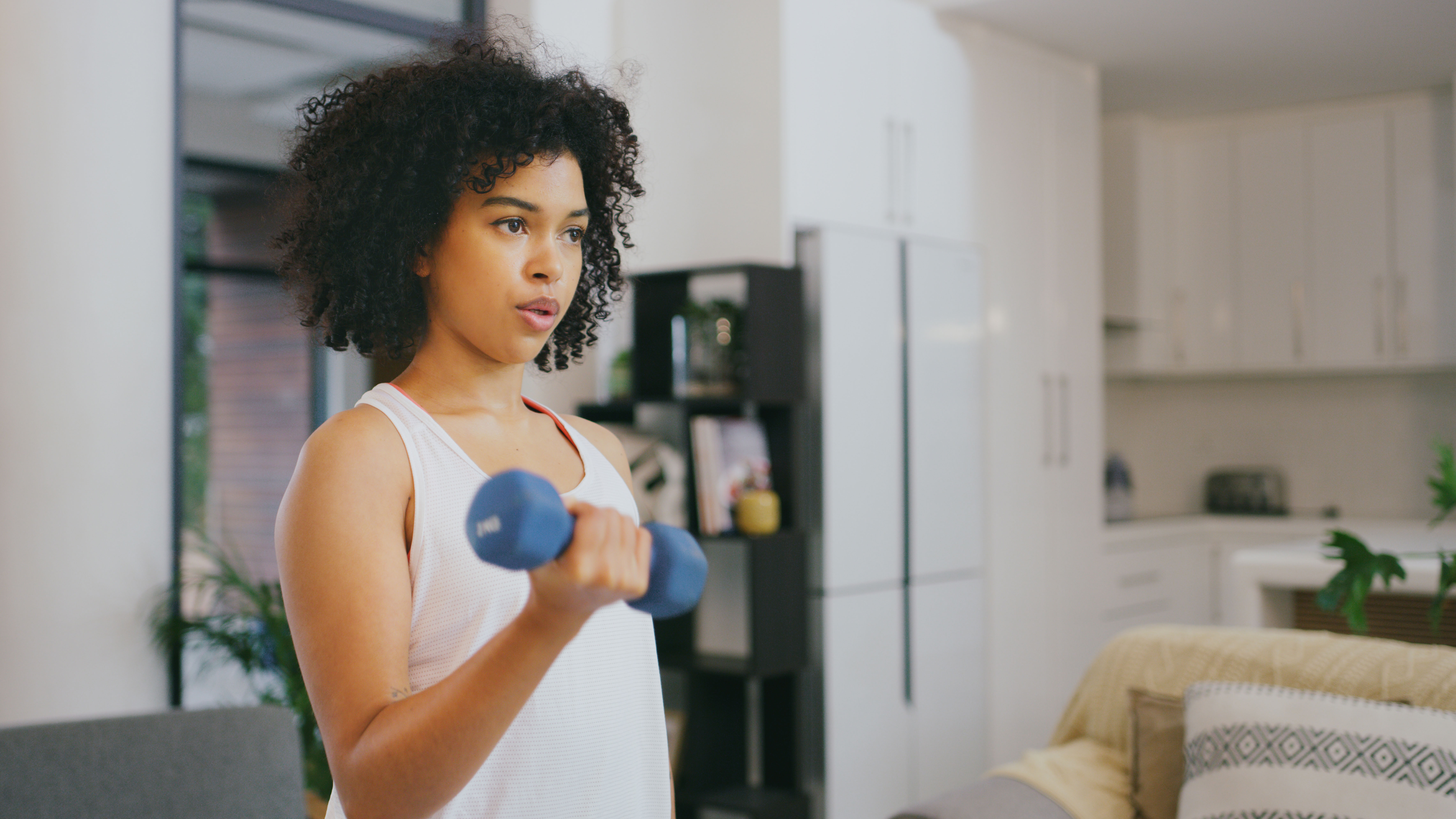 woman doing biceps curl