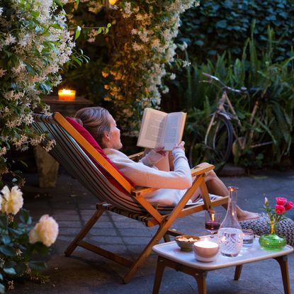 The best summer candles laid out on an outdoor table setting