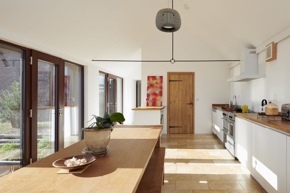 The single-storey cowshed now houses the kitchen, utility and plant room