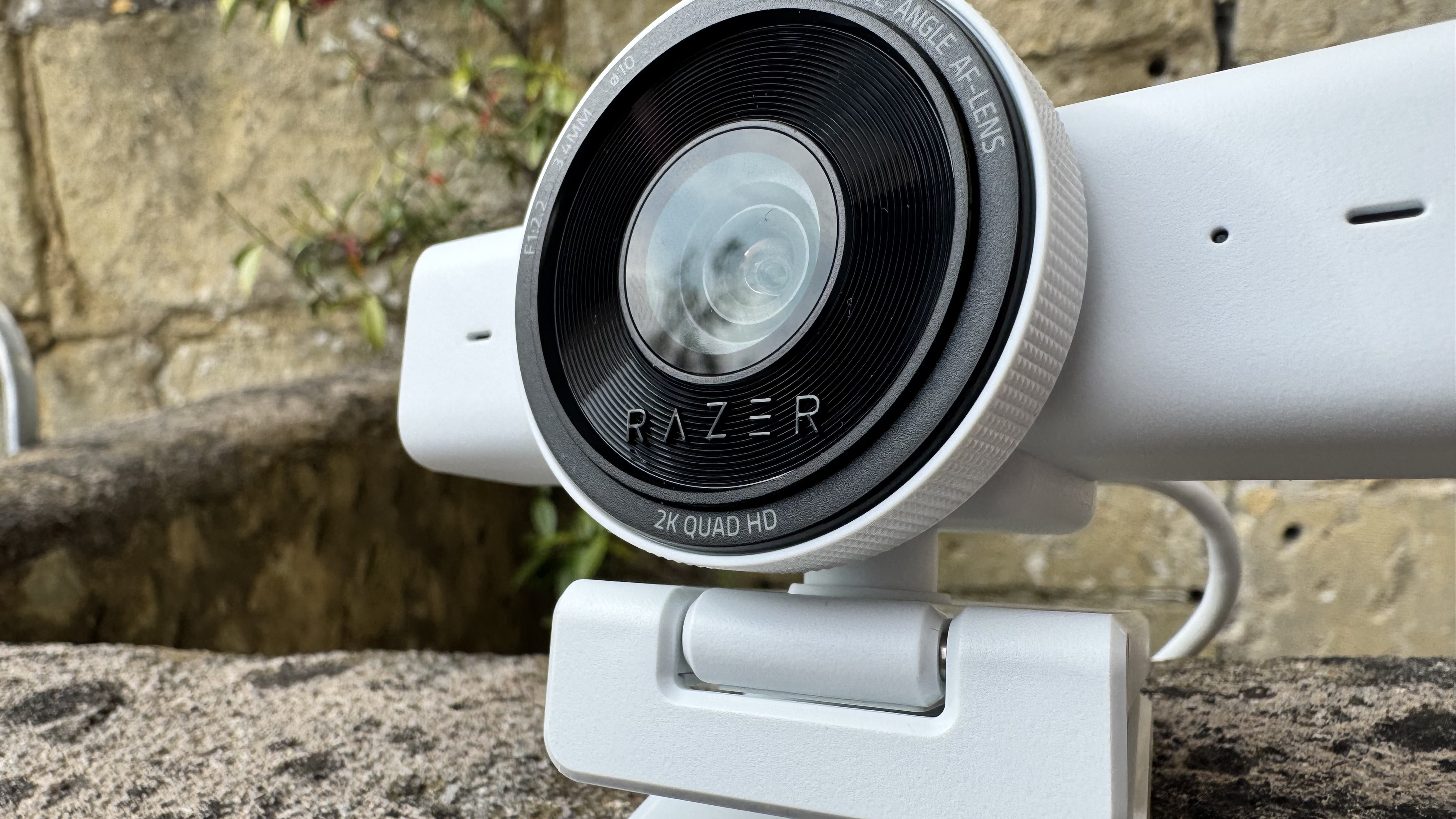 The Razer Kiyo V2 X webcam from the front right, showing the lens