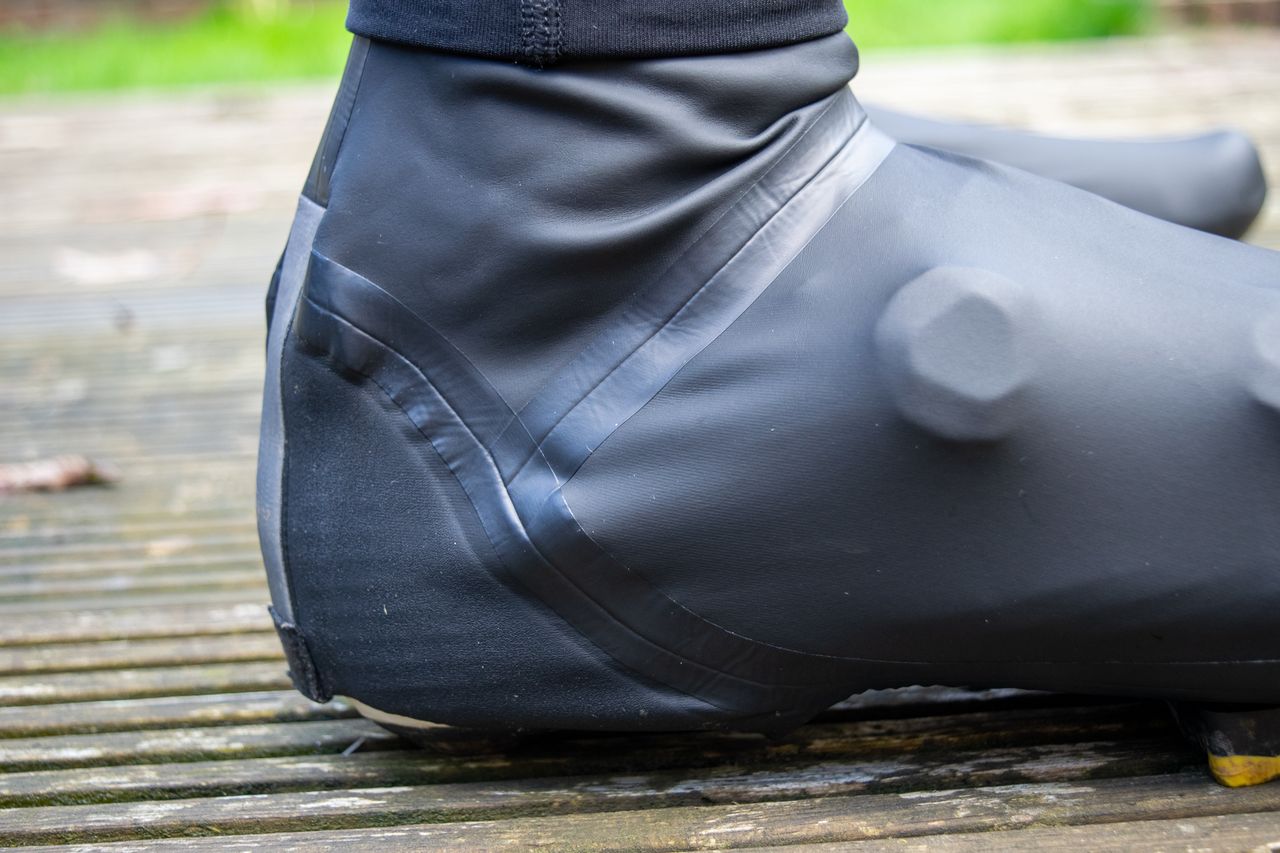A rider wearing the GripGrab Aquashield overshoes