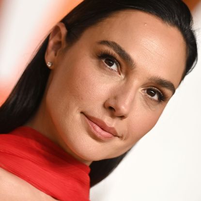 Gal Gadot wearing red at the Vanity Fair Oscar Party