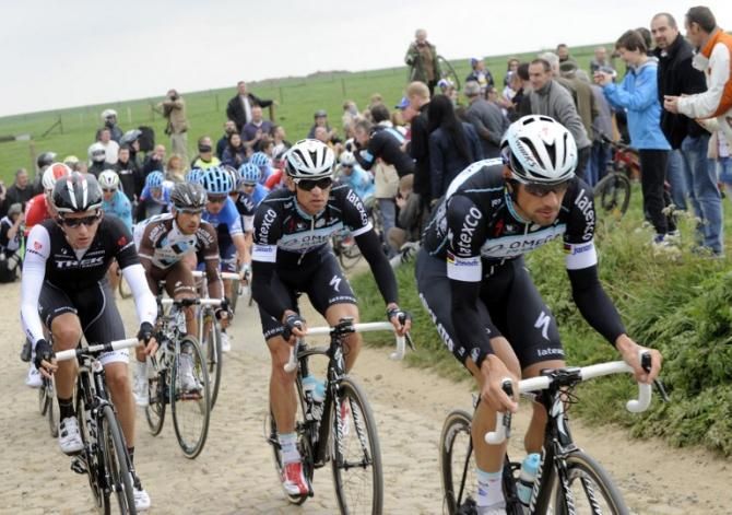 (From R) Belgium's Tom Boonen (Omega Pharma-Quick Step) rides through the Troisvilles trench