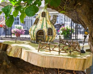 wooden fairy house on the branch of a tree