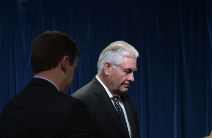 Secretary of State Rex Tillerson leave the stage