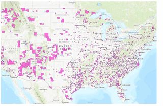 A map of the United States with the over 8,000 qualified opportunity zones highlighted in pink.