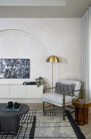 arched accent wall in limewash in a modern living room