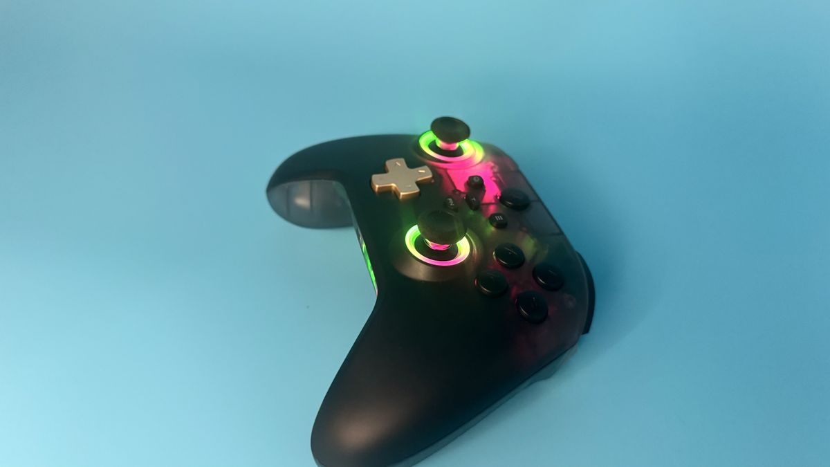 EasySMX D05 black gaming controller from the side (with rainbow RGB) on a blue background
