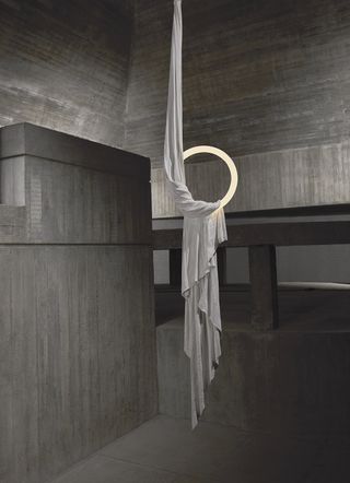 Hoop light by Lee Broom suspended from a concrete ceiling