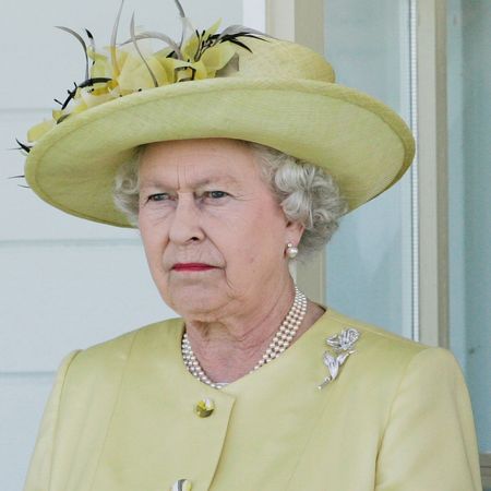 Queen Elizabeth wearing a green hat and coat