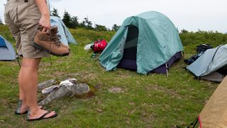hiker with blisters at campsite on Appalachian Trail