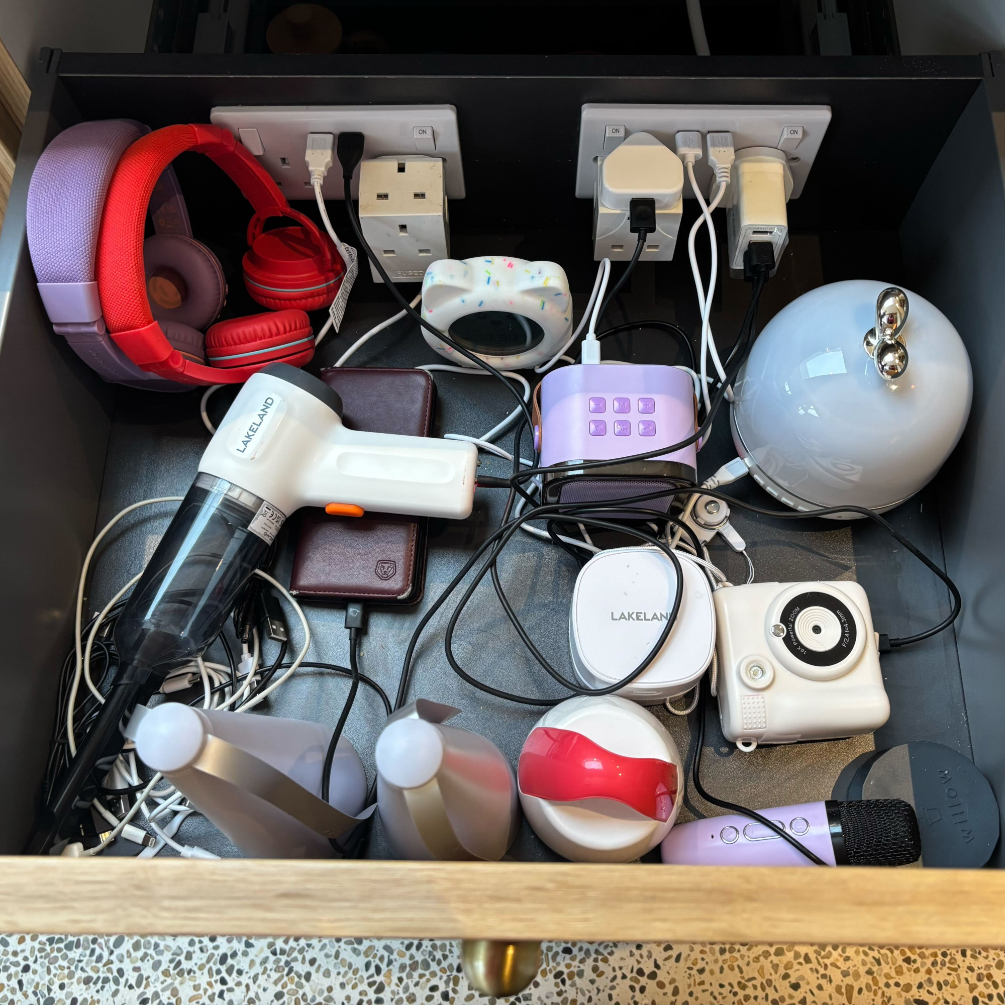 charging drawer with sockets cables and devices