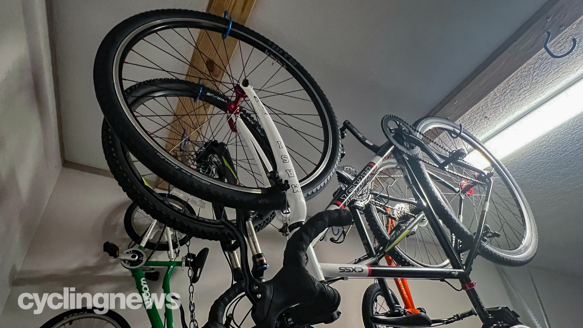 Park Tools Bike hook with bikes hanging from a garage roof