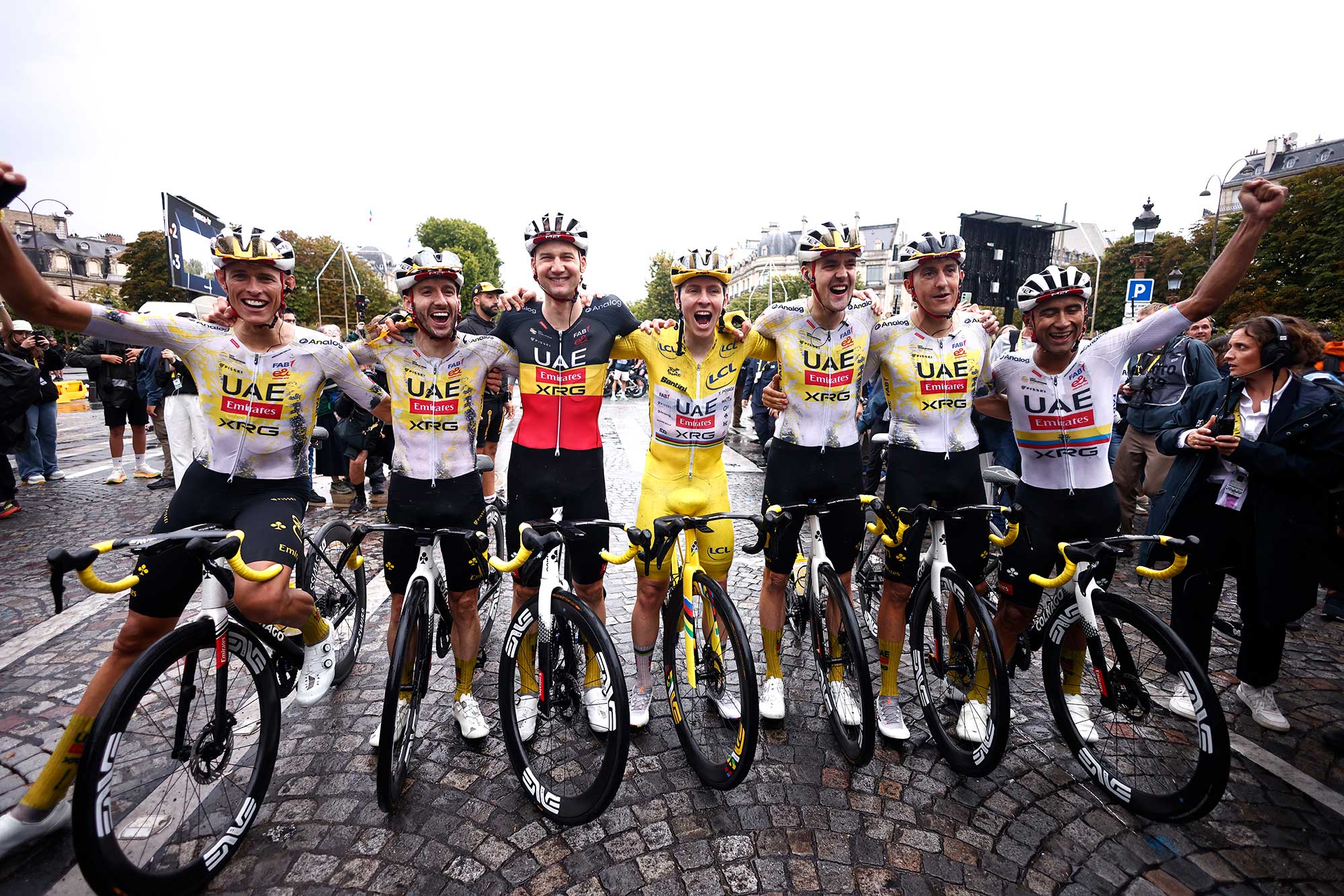 PARIS - CHAMPS-ELYSEES, FRANCE - JULY 27: The final overall winner, Tadej Pogacar of Slovenia and UAE Team Emirates - XRG - Yellow leader jersey celebrates with his teammates Jhonatan Narvaez of Ecuador, Nils Politt of Germany, Pavel Sivakov of France, Marc Soler of Spain, Tim Wellens of Belgium, Adam Yates of Great Britain after the 112th Tour de France 2025, Stage 21 a 132.3km stage from Mantes-la-Ville to Paris - Champs-Elysees / #UCIWT / on July 27, 2025 in Paris - Champs-Elysees, France. (Photo by Yoan Valat - Pool/Getty Images)