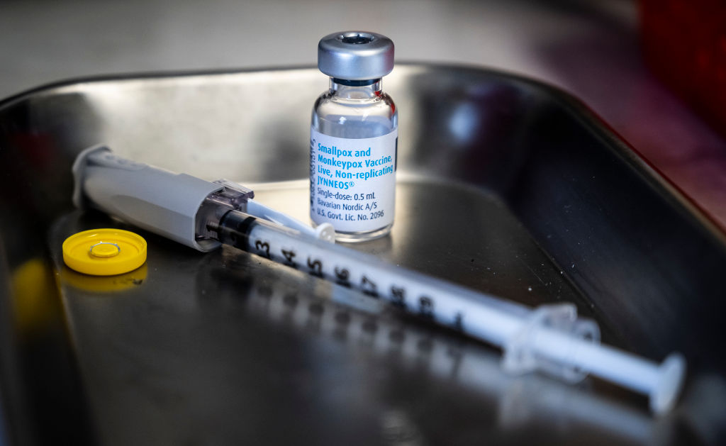 A close up of a vaccine vial and syringe.