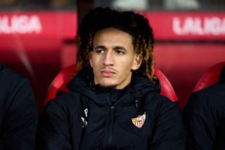 Manchester United midfielder Hannibal Mejbri looks on from the bench ahead of Sevilla's clash with Girona.