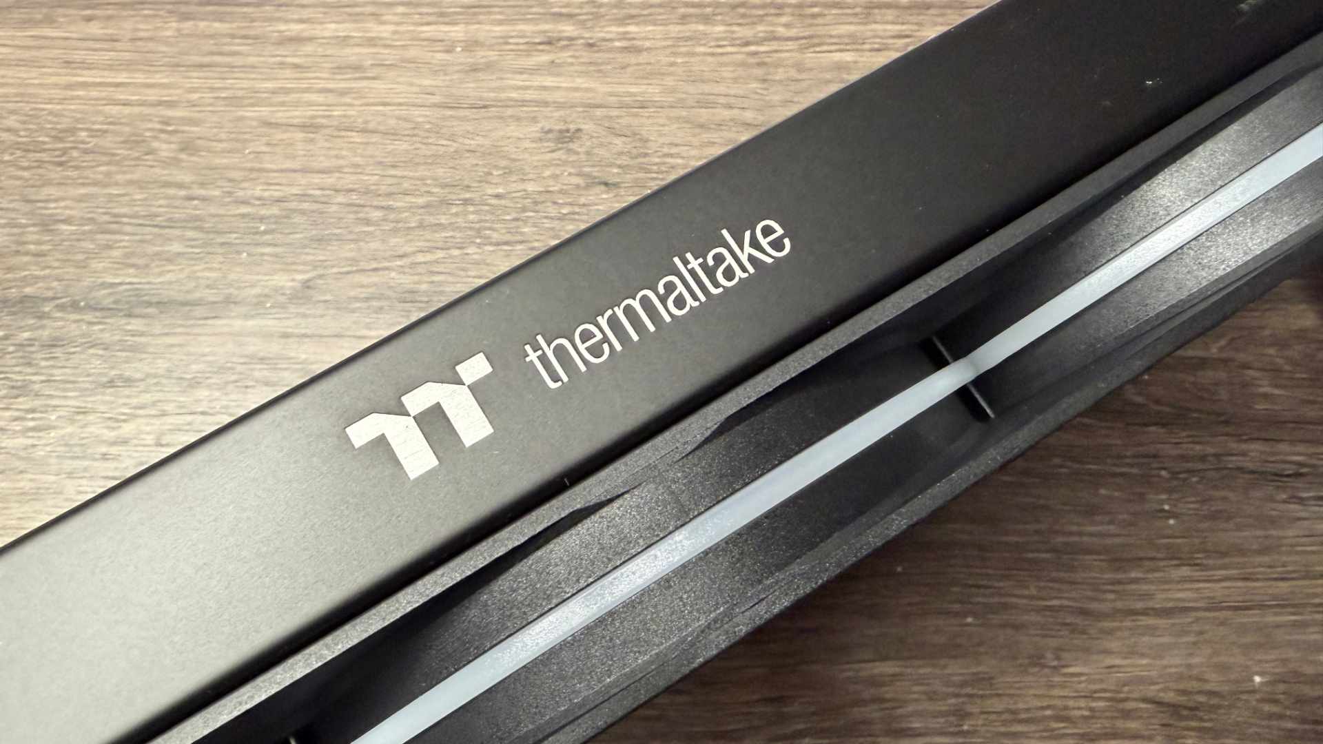 Thermaltake TH360 V3 Ultra ARGB Sync outside of a PC case with fans installed.