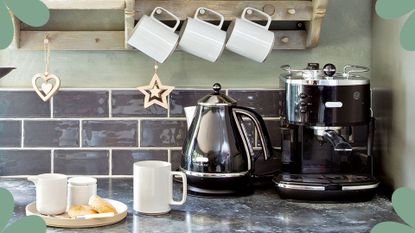 Kitchen worktop with hot drinks station set up with cups, kettle and coffee machine to support the question how often should you descale your kettle