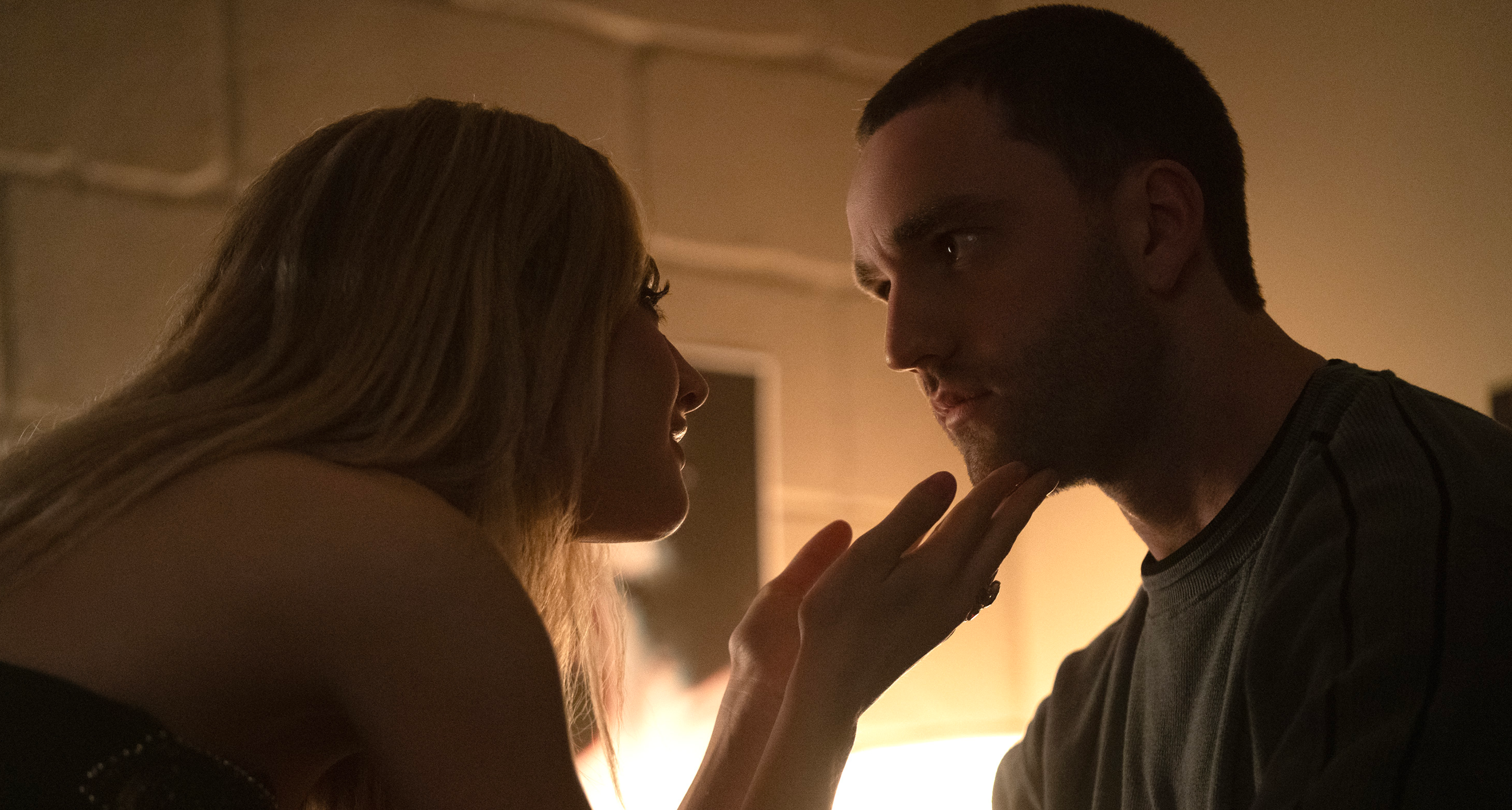 grace van patten and jackson white lean in to kiss in a dorm room in tell me lies season 3