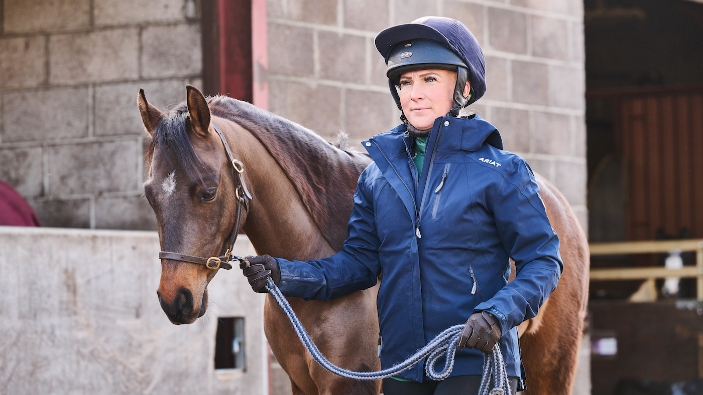 Experienced handler leading a pony