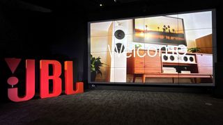 JBL demo exterior showing welcome sign and red JBL logo