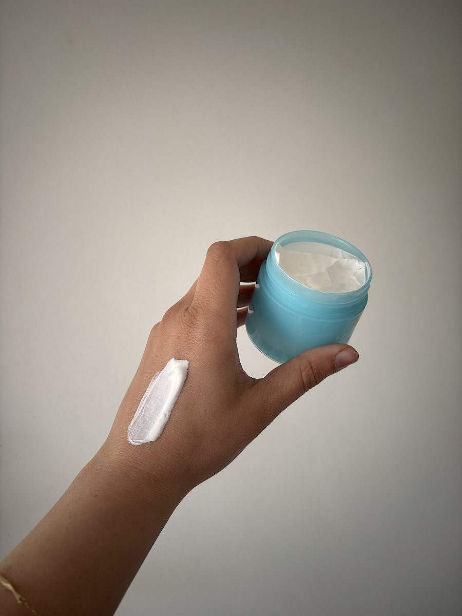 Mica Ricketts showing swatch of E.L.F. Skin Holy Hydration! Face Cream SPF 30