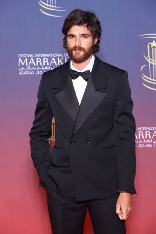 A bearded Jacob Elordi wearing a tuxedo attends the Ceremony Tribute to Sean Penn during Day Two Of the 21st Marrakech International Film Festival on November 30, 2024 in Marrakech, Morocco