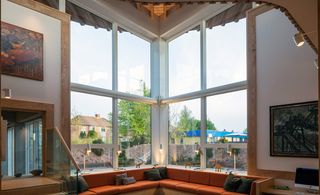 Giant windows look on to a south-facing courtyard and the centre is enclosed by beech hedges and grassy banks, planted with wild flowers