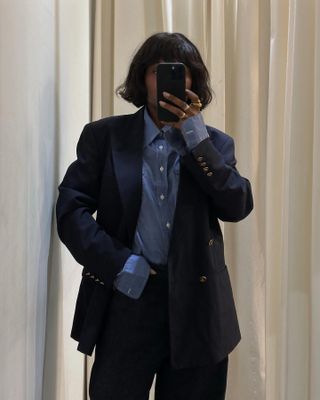 French girl wearing a blazer with jeans for spring