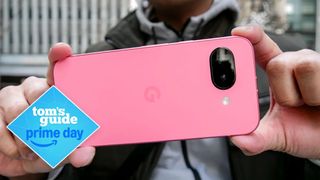 Google Pixel 9a held in hand with prime day deal logo