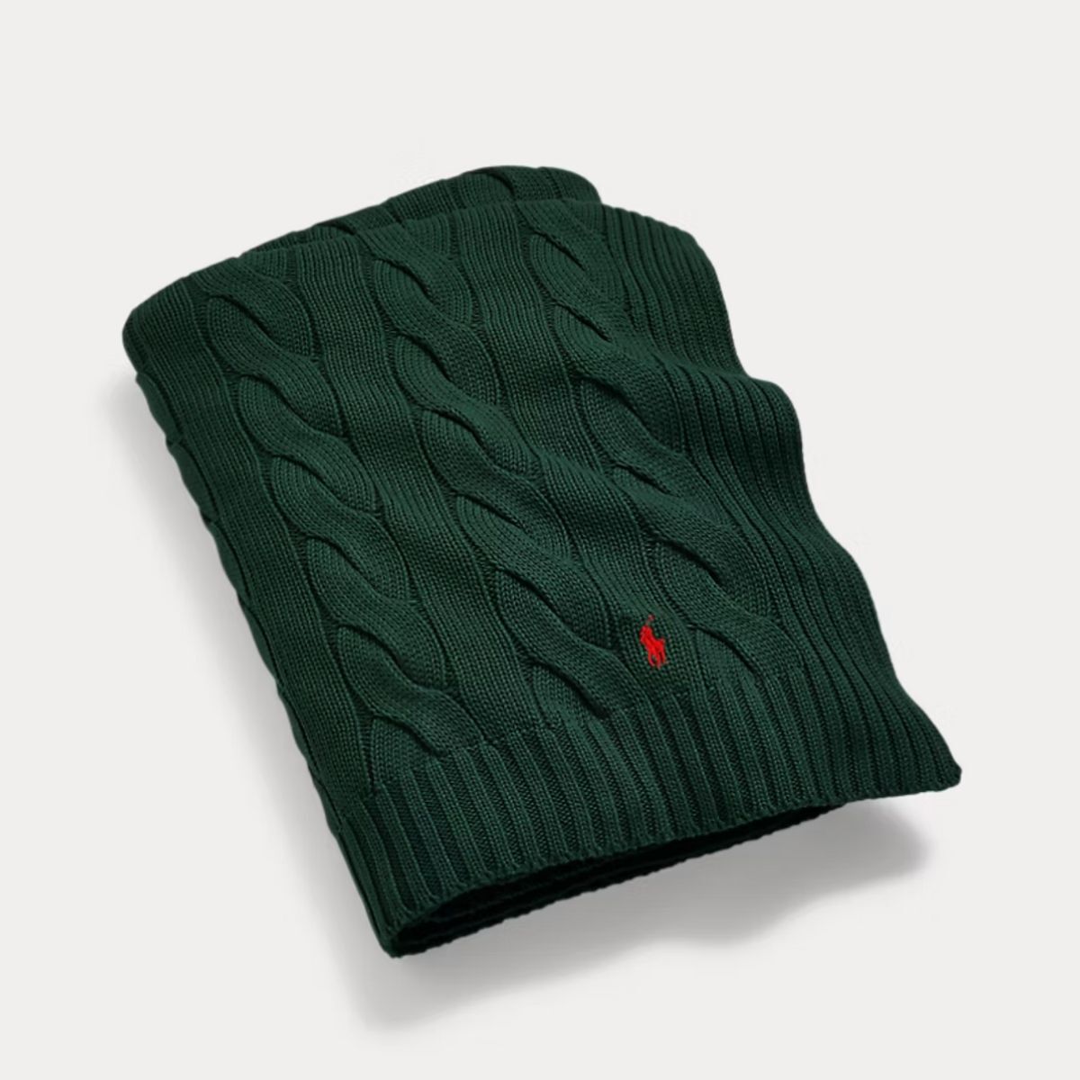 A dark green Ralph Lauren throw