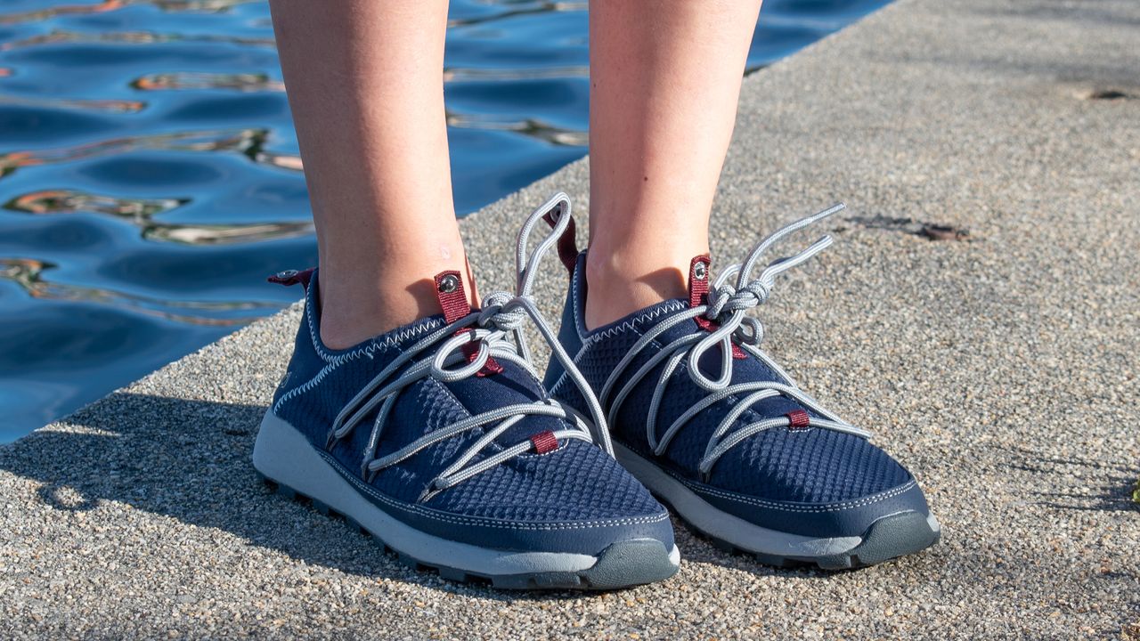 Person wearing Craghoppers Locke Packaway shoes on waterside