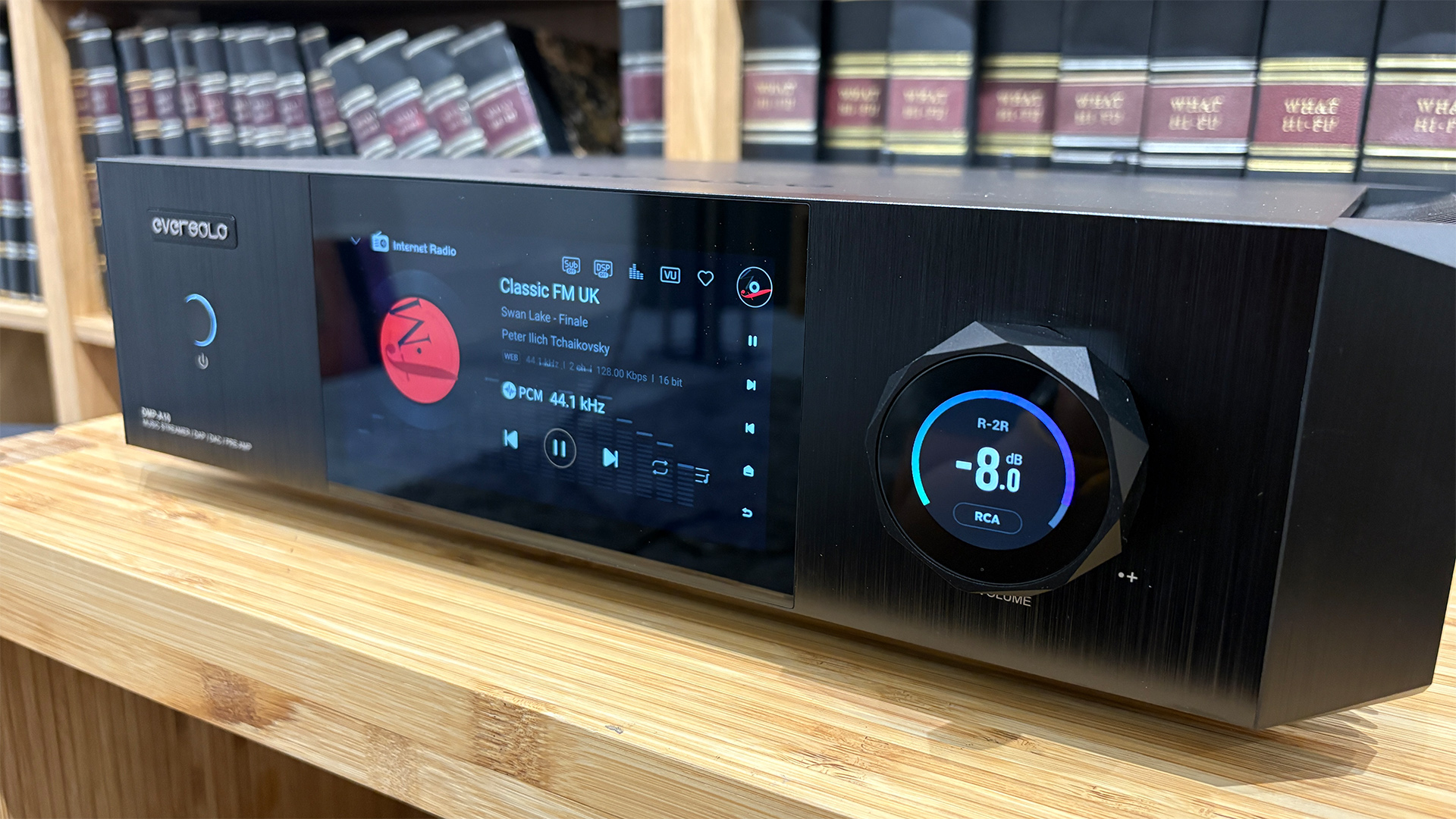 Eversolo DMP-A10 streaming amplifier on wooden hi-fi rack with Classic FM UK on display screen