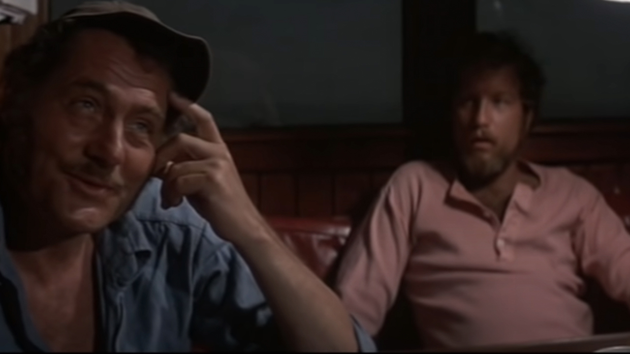 Robert Shaw in the foreground, scratching his head, as Richard Dreyfuss looks on behind him in Jaws.