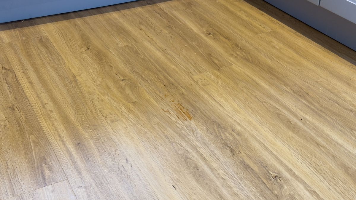 Hard floor with ketchup smeared over it &ndash; after second clean with Dyson Spot+Scrub