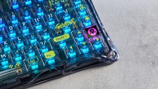 A GravaStar Mercury K1 Lite mechanical keyboard with shine-through keycaps