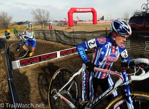 Katie Compton (Planet Bike) leads Georgia Gould over the barriers.