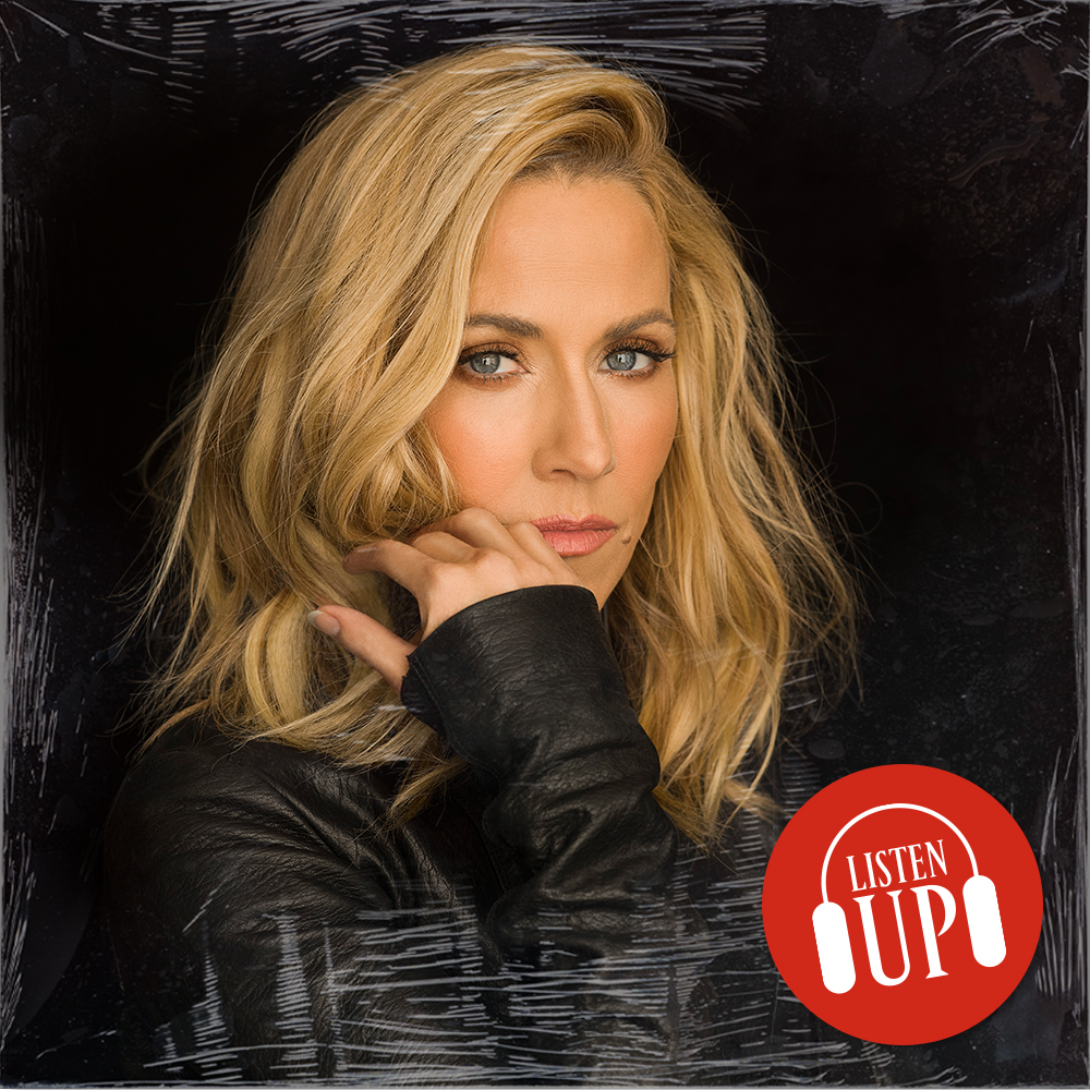 a headshot of singer sheryl crow wearing a leather jacket and resting her chin in her hand with the logo for the marie claire franchise listen up