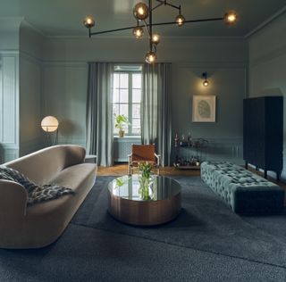 Sandelsandberg stockholm apartment lounge with cream sofa and pale mint walls