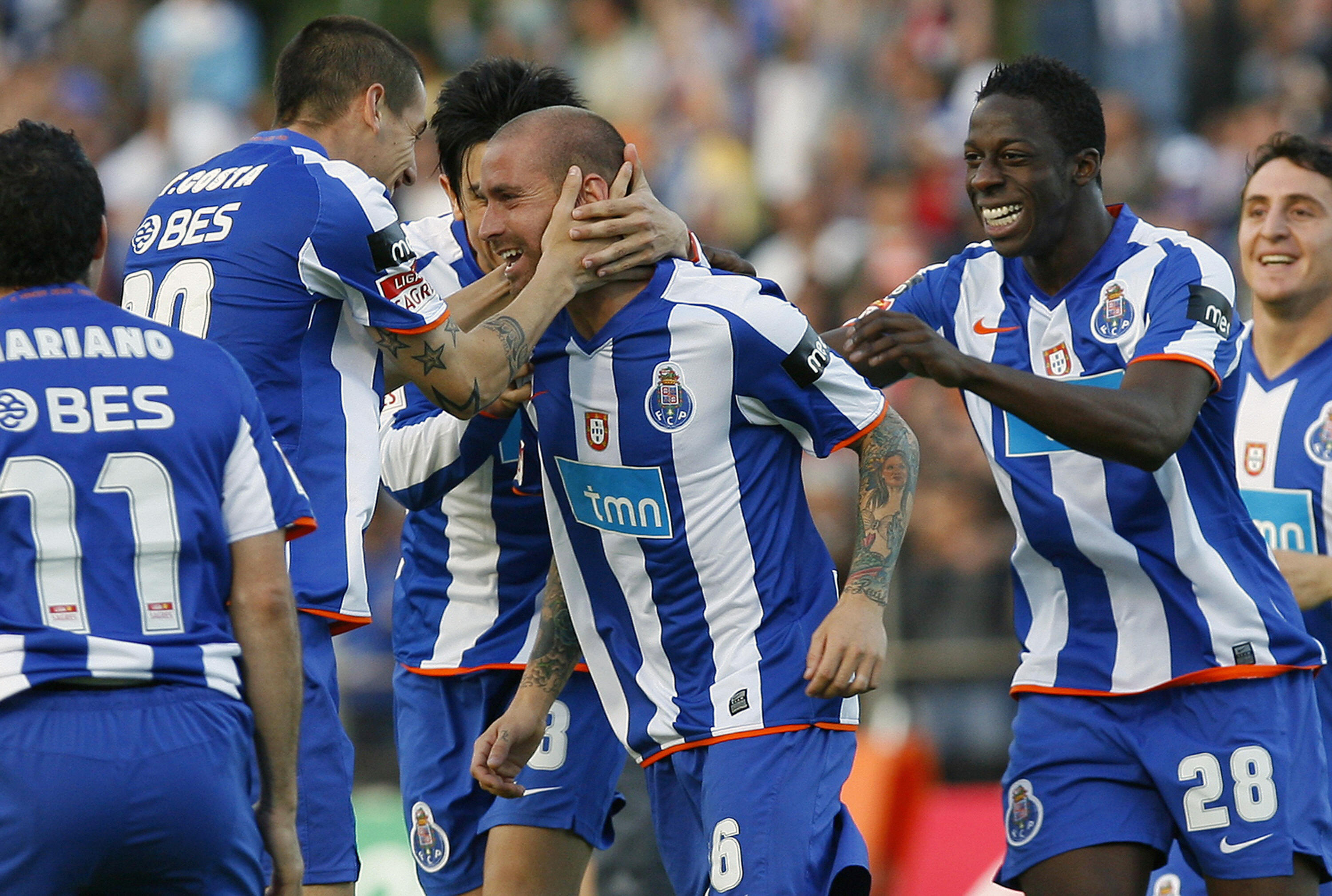 Porto players celebrate a goal against Maritimo in May 2009.