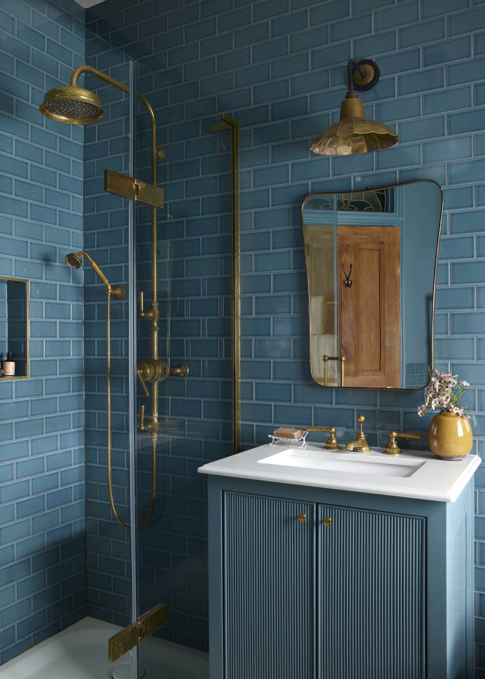 small ensuite bathroom with blue color drench