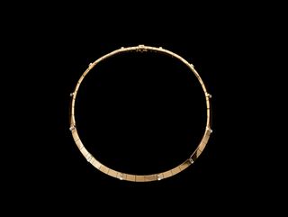 Necklace with circular shapes crafted in 18-karat yellow gold and accented with white diamonds