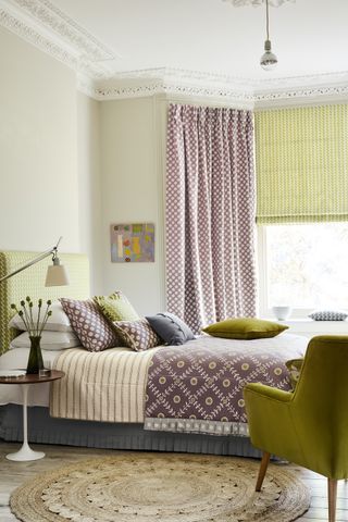 A combination of blinds and fulkl length curtains to dress a bay window