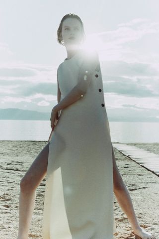 Woman in dress on beach