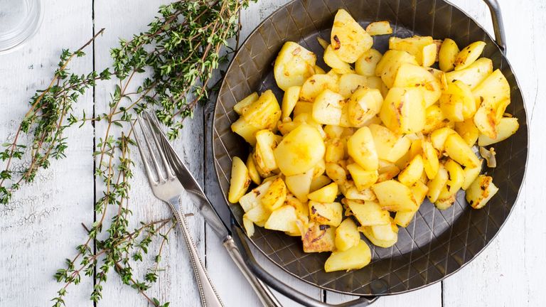 Cast iron pan with potatoes 