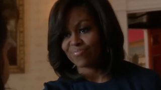 Michelle Obama in close up, smiling in NCIS