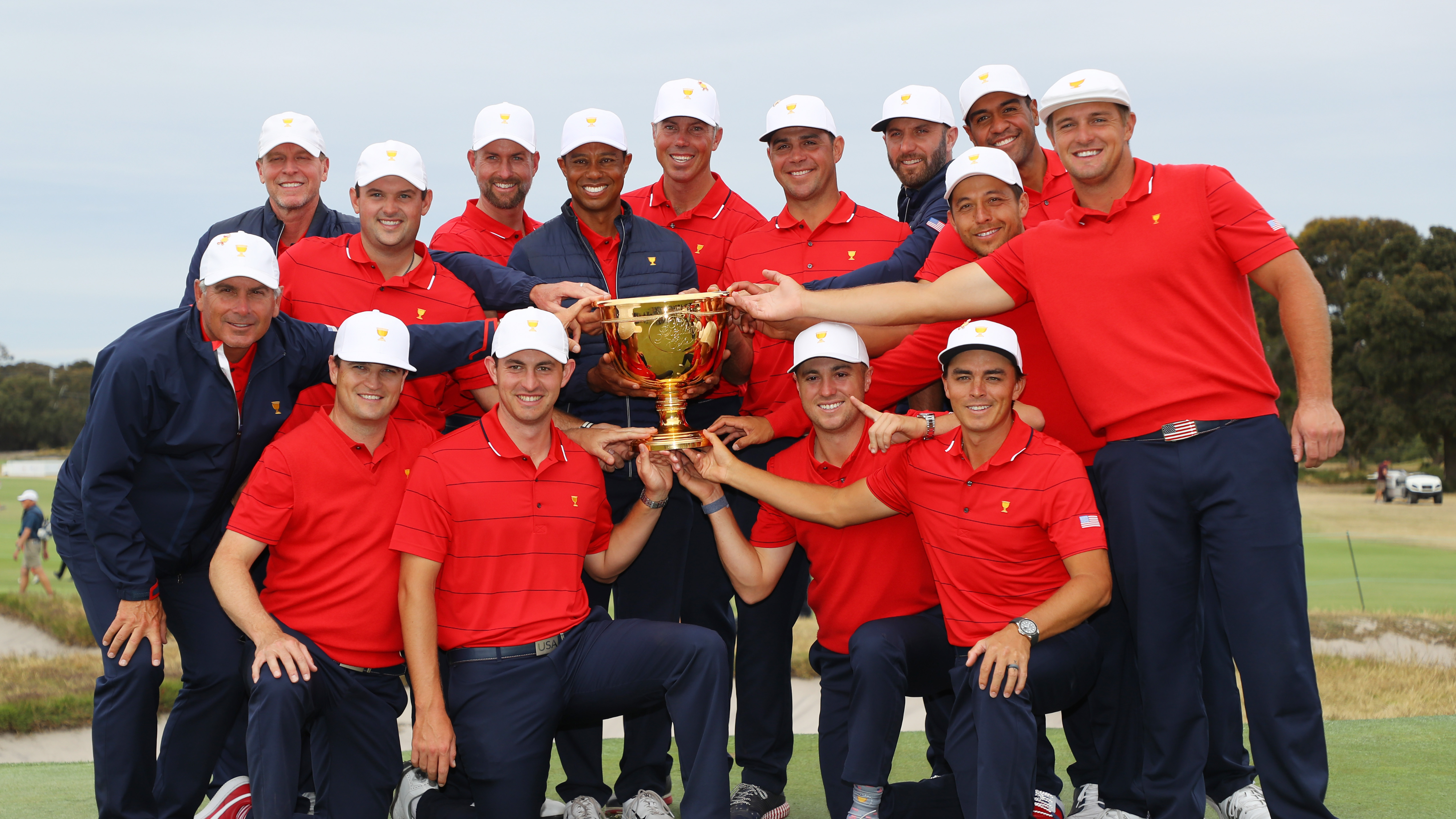 2019 American Presidents Cup winning team all holding the trophy
