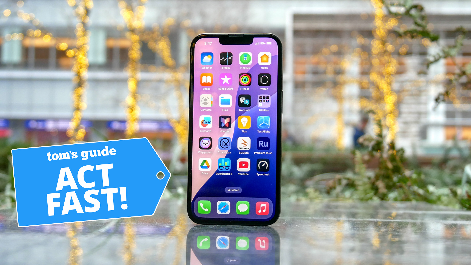 iPhone 16e  on surface with Act Fast badge nearby.