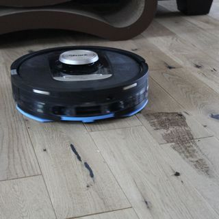 Shark PowerDetect 2-in-1 Robot Vacuum and Mop with NeverTouch Base Pro mopping hardwood floor